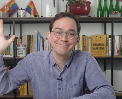 Simon waving to the camera in their last video